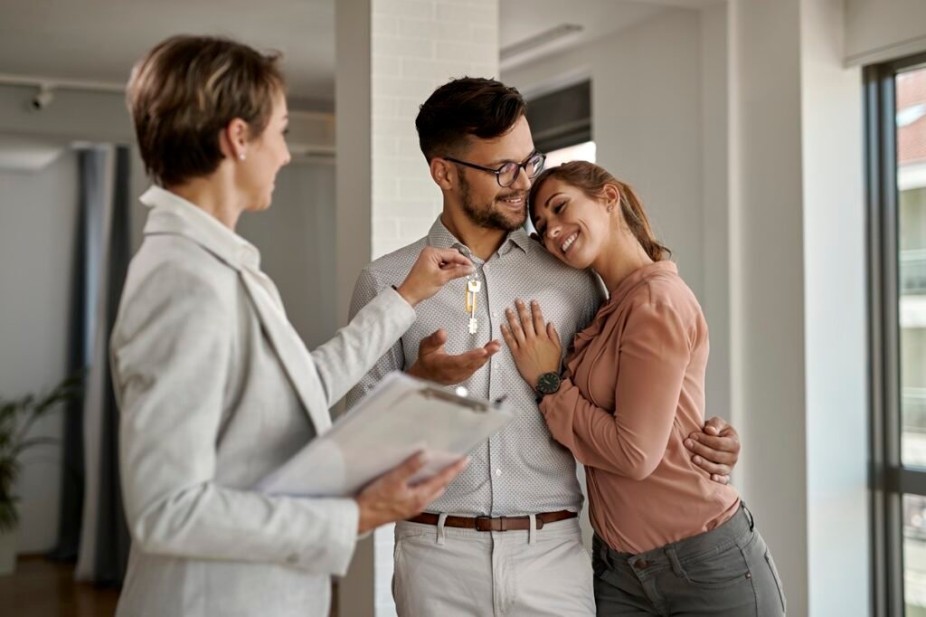happy-couple-receiving-keys-to-a-new-home-2026-01-06-10-41-26-utc.jpg